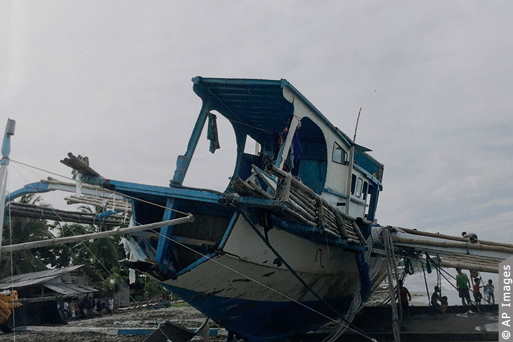 Damaged Filipino fishing boat F/B Gimver 1 sits ashore in Mindoro province, Philippines. China acknowledged one of its vessels hit a Filipino boat in the South China Sea in an incident that prompted an outcry in the Philippines. © AP Images