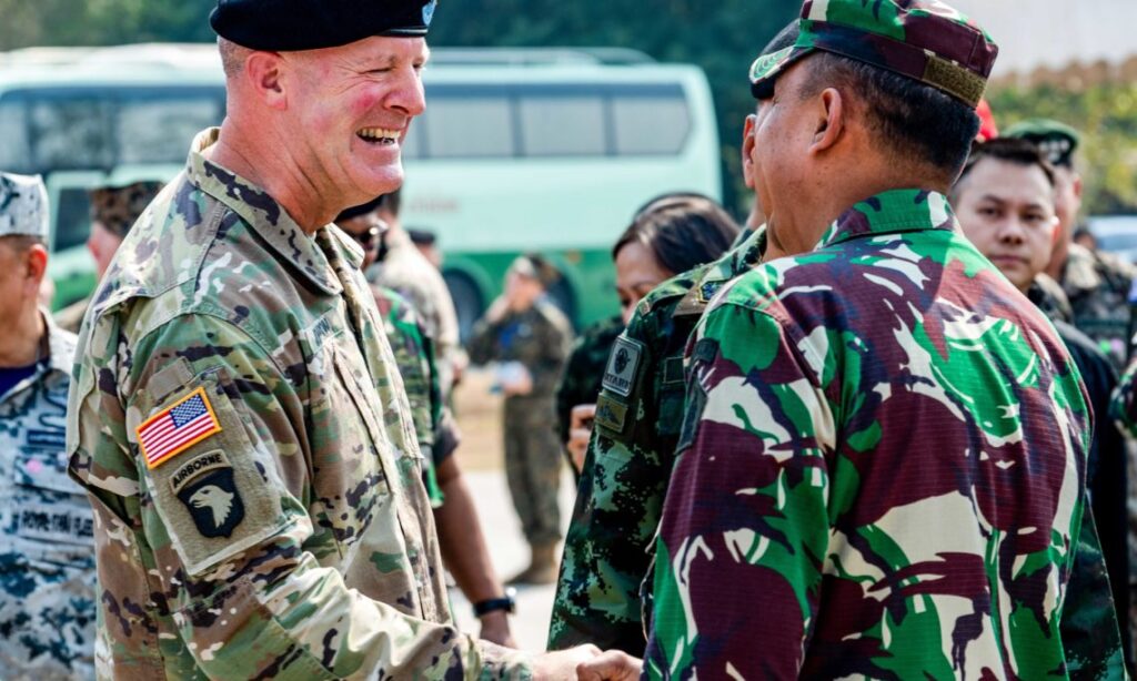 U.S. Army Maj. Gen. Pete Johnson, U.S. Army Pacific deputy commander representing U.S. Indo-Pacific Command, shakes hands with an Indonesian soldier during the opening ceremony of exercise Cobra Gold 2020 (U.S. Navy photo by Mass Communication Specialist 1st Class Julio Rivera)
