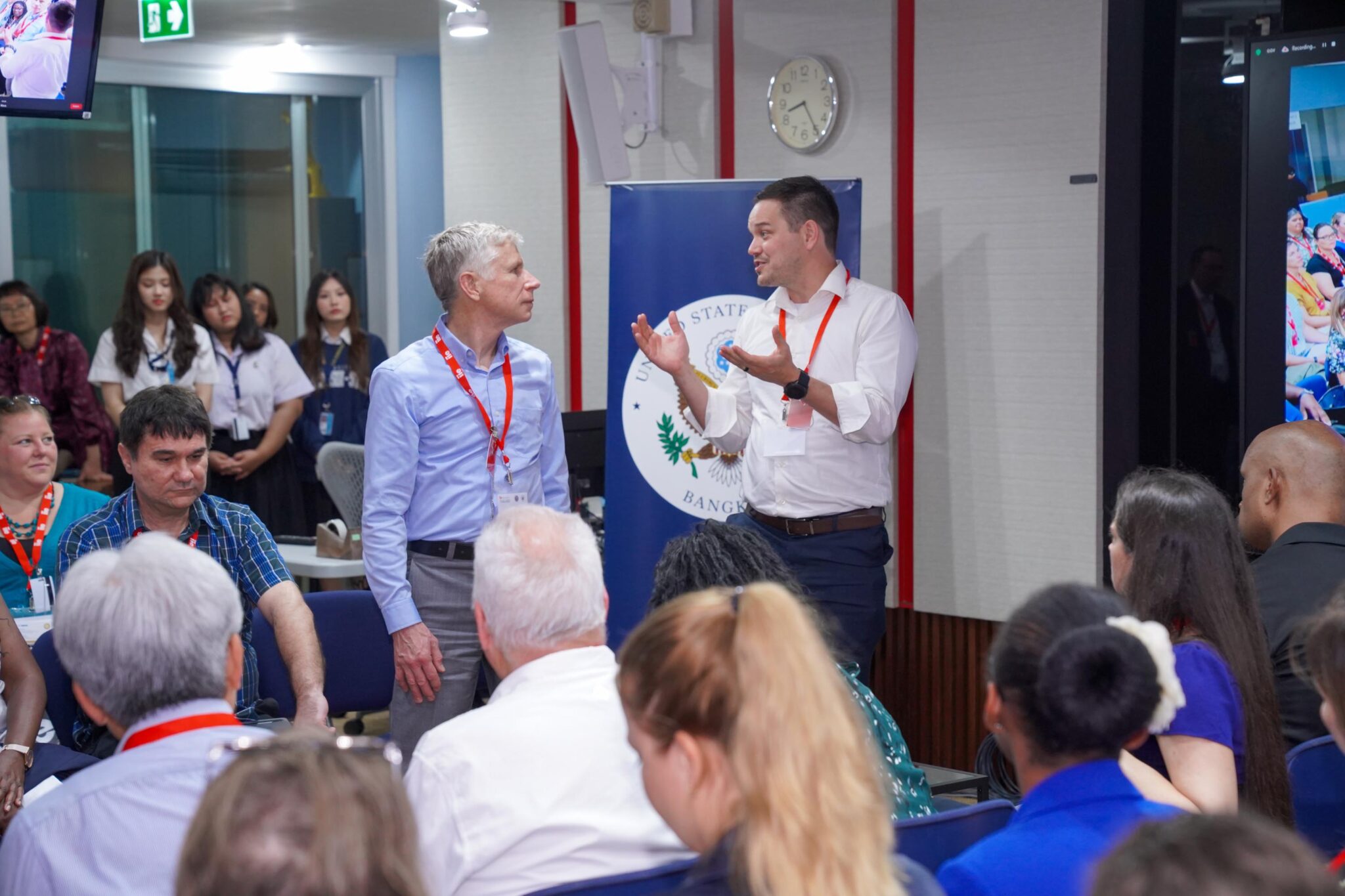 Two participants from audience speaking