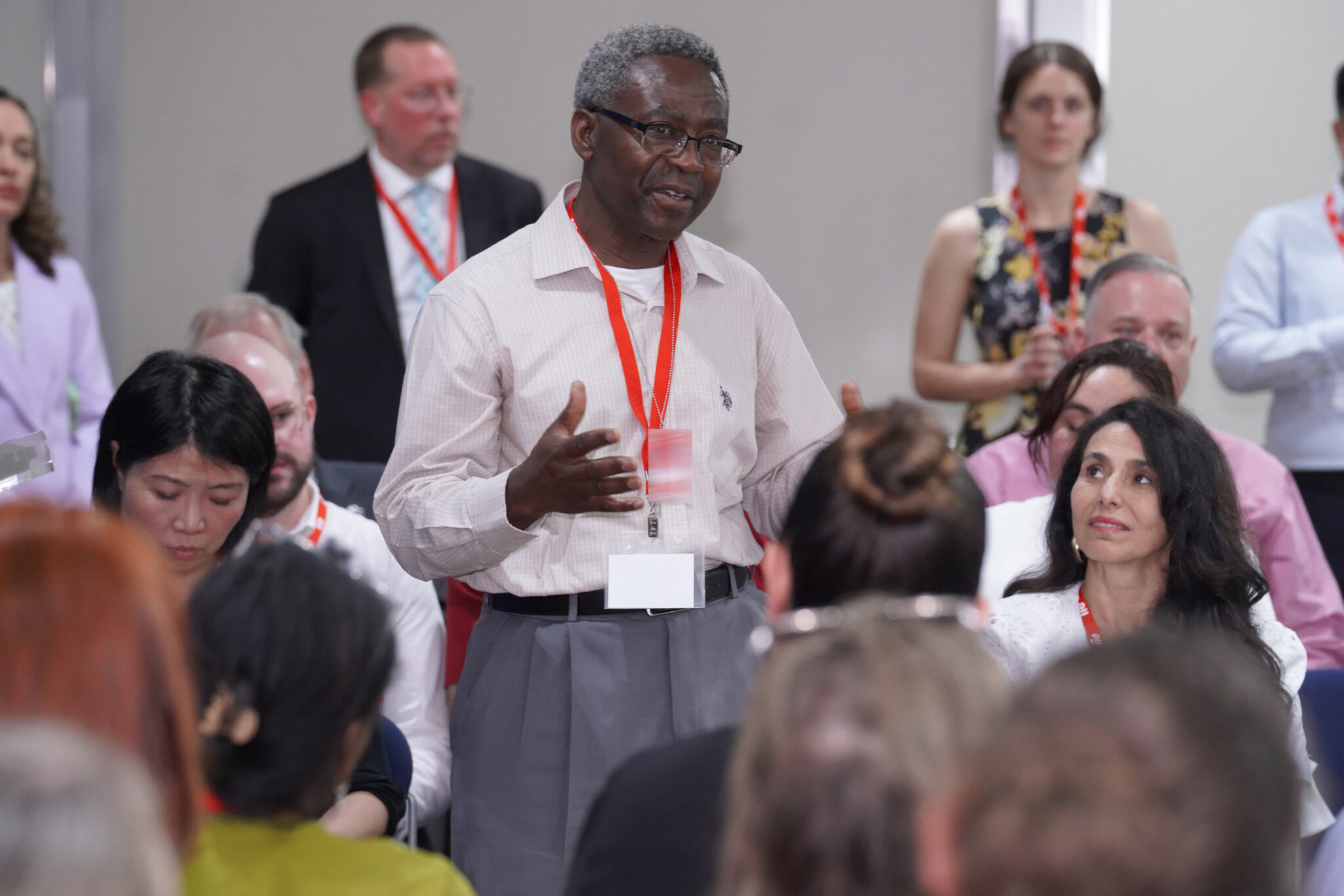 Audience participant standing for comment